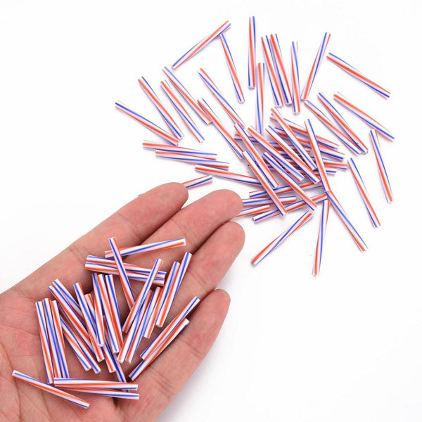 30gms RED WHITE AND BLUE GLASS BUGLE BEADS LONG 30mm x 2.5mm