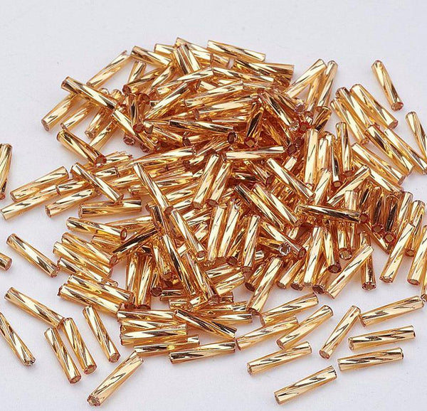 50g 6mm BUGLE BEADS TWISTED METALLIC GOLD GLASS